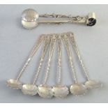 A set of six Japanese silver teaspoons, and similar sugar nips each with circular bowl, twist and