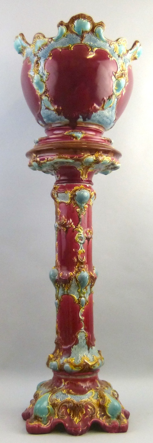A late Victorian majolica jardiniere on plinth, in the Minton style, the jardiniere of bulbous