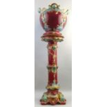 A late Victorian majolica jardiniere on plinth, in the Minton style, the jardiniere of bulbous