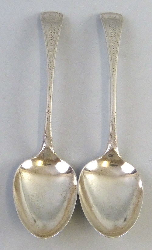 A pair of George III Newcastle tablespoons, with chased decoration, marks rubbed