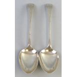 A pair of George III Newcastle tablespoons, with chased decoration, marks rubbed