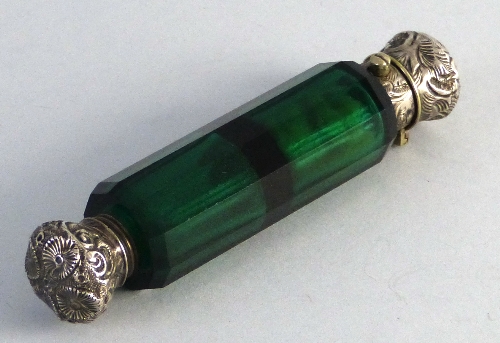 A Victorian green glass double ended scent bottle, with hinged and screw thread embossed and