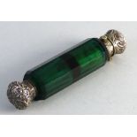 A Victorian green glass double ended scent bottle, with hinged and screw thread embossed and