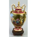 A Vienna porcelain vase and cover, of two handled urn shaped form the body printed and painted