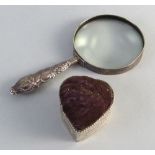 An Edwardian magnifying glass, the nickel framed lens with embossed silver handle, 18.5cm long