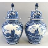 A pair of Dutch 'Delft' lidded vases, each of bulbous hexagonal form printed in blue and white