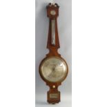 A 19th century walnut cased banjo mercury barometer, with swan neck pediment, humidity, spirit level