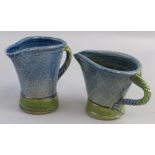 Jane Hamlyn, two graduated salt glazed stoneware jugs each of tapering form with rope twist handle