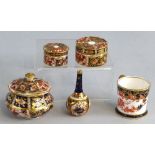 Royal Crown Derby in pattern 1128, miniature bottle vase, small cup and three various lidded