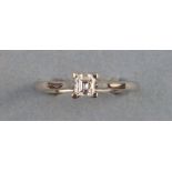 A solitaire diamond ring, a princess cut single stone with claw setting on 18ct white gold shank,