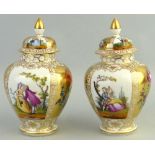 A pair of continental lidded vases, each of bulbous form painted with alternate panels of lovers