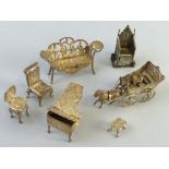 A collection of seven miniature items, grand piano, coronation chair, coach and horse and four