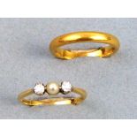 A wedding ring, 22ct gold, 3.6gms and a three stone engagement ring having central pearl flanked