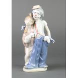 A Lladro Society group of a clown and lady with 2 puppies, 7686, boxed 9"This lot is in good