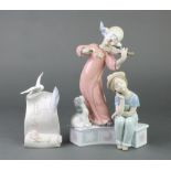 A Lladro group of a clown playing a violin next to a seated lady and puppy, 6900, boxed 11",