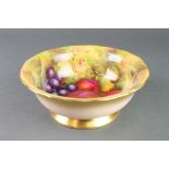 A Royal Worcester fruit bowl decorated with fruits and leaves by E Townsend 10"There are some
