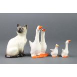 A Beswick group of 2 geese together with 2 goslings and a seated figure of a siamese catAll items