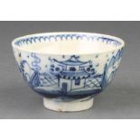 An 18th Century Delft tea bowl with a pavillion in a garden landscape with simple decoration to
