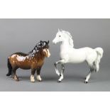 A Beswick figure of a grey dappled horse 7", a ditto of a Shetland pony 8"The grey horse has some