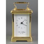 William Widdop, a 20th Century carriage clock with enamelled dial and Roman numerals contained in