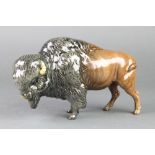 A Beswick figure of a standing Bison 9 1/2"This bison has a minor scratch to his nose but is