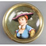 A Continental porcelain dish decorated a portrait of a lady in a brass mount 5 1/2"