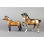 A Beswick figure of a standing horse with raised front right leg 9" and a figure of a standing
