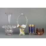 An Edwardian glass epergne with wavy rim, a basket and 2 vases