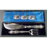 A cased pair of Edwardian silver plated fish servers, 3 spirit labels The fork handle has been re-