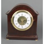 A 19th Century French 8 day striking mantel clock with enamelled dial, Roman numerals, contained