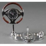 William Widdup, a desk timepiece in the form of a classic car steering wheel and gear stick 4"