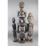 A carved African hardwood figure of 2 standing gentleman 27 1/2", some old and treated worm, 1 other