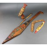 An Australian painted wooden paddle 36", a boomerang, a carved figure of a  bird 12" and 3 other