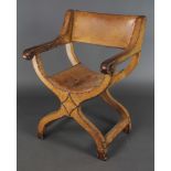 An Italianate style open armchair upholstered in bleached brown leather There is a tear to the seat