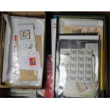 A quantity of used world stamps contained in a cardboard box