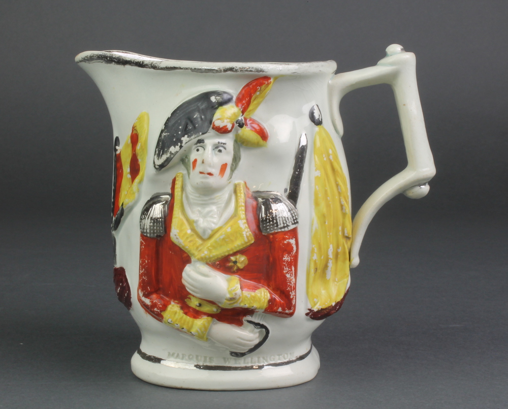 An early 19th Century Staffordshire polychrome commemorative jug decorated with portraits in