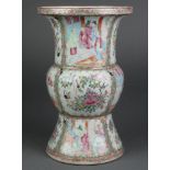 A 19th Century famille rose Gu shaped vase with panels of figures in pavilions alternating with