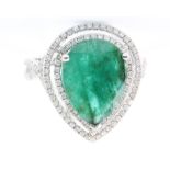 A 14ct white gold pear cut emerald and diamond cluster ring, the centre stone approx 6ct