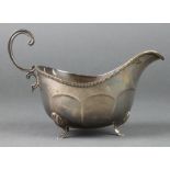 A silver sauce boat with S scroll handle on hoof feet, Birmingham 1939, 202 grams