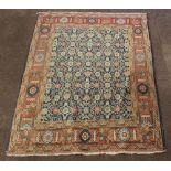 A Persian Isfahan rug with blue ground and floral pattern 71" x 55"