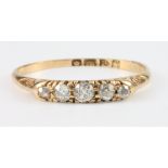 An 18ct yellow gold 5 stone diamond ring, size P