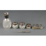 A repousse silver nail buffer, 4 lidded items and a button hook