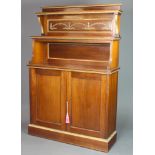 A 19th Century mahogany chiffonier, the raised back fitted 2 shelves above a recess and with