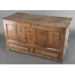 A 17th/18th Century oak mule chest of panelled construction with hinged lid, the interior fitted a