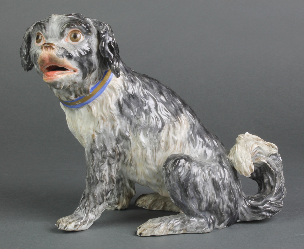 A good 19th Century Meissen figure of a seated Terrier with open mouth, impressed and under glazed