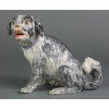 A good 19th Century Meissen figure of a seated Terrier with open mouth, impressed and under glazed