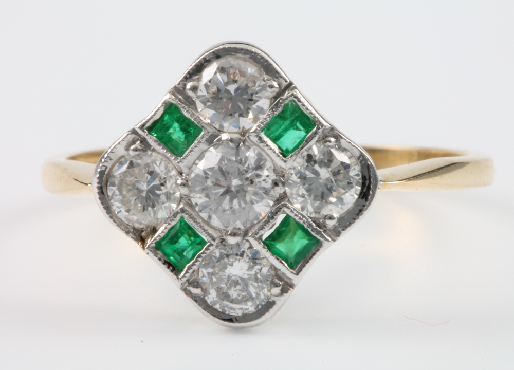 An 18ct yellow gold emerald and diamond Art Deco style ring with 4 princess cut emeralds and 5
