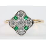 An 18ct yellow gold emerald and diamond Art Deco style ring with 4 princess cut emeralds and 5