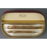 A boxed gold plated engine turned Onoto fountain pen and propelling pencil