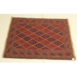 A red and blue ground Gazak rug having stylised diamonds to the centre 47" x 43"